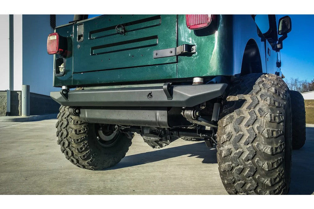https://serenity-foxfactory.asset.akeneo.cloud/fox_asset_family/media/cwl_tj20201_lifestyle_01_jeep_tj_pyro_rear_bumper.jpg